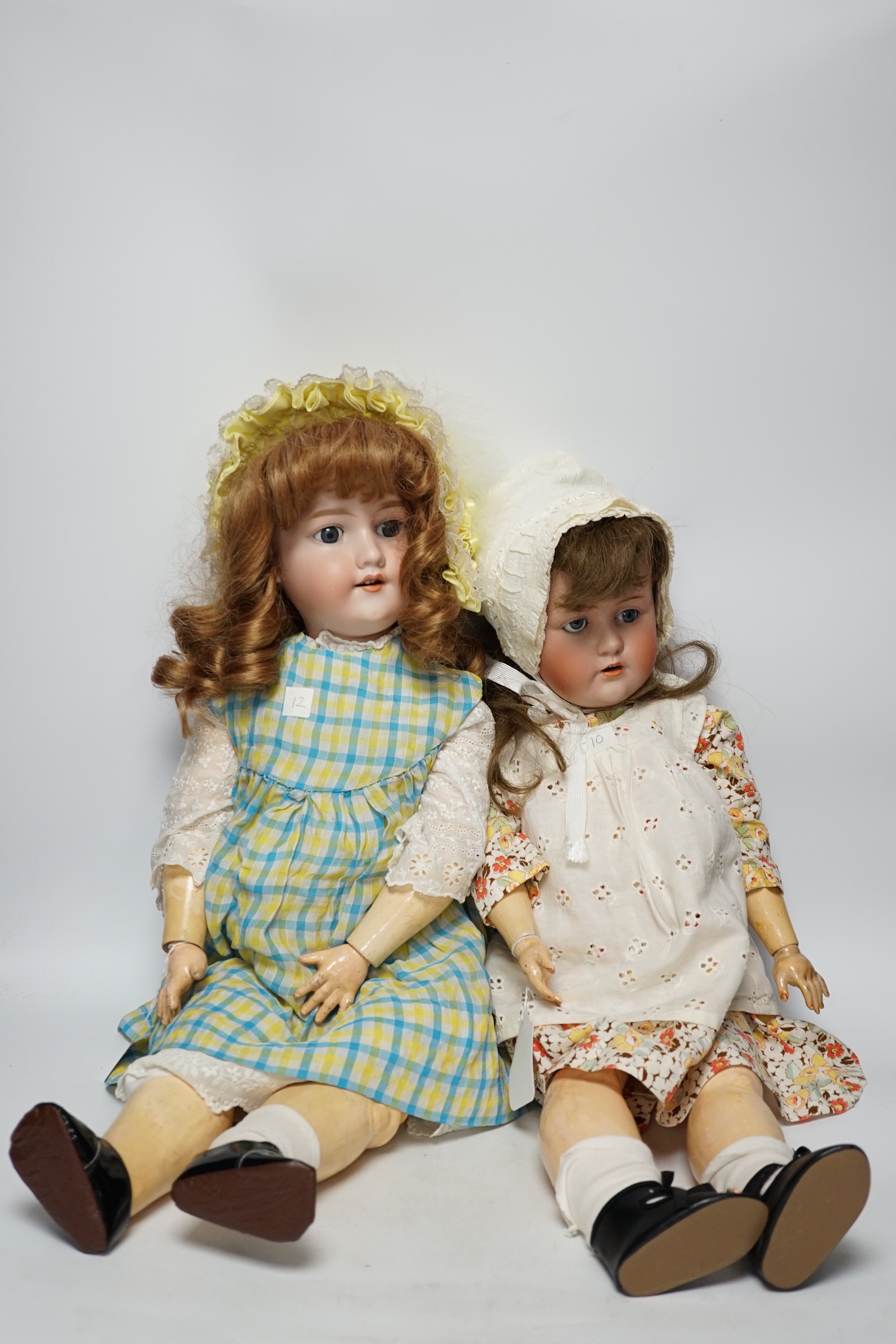 A Kestner JDK 168 bisque doll, 65cm and an AM390 doll with bisque head, 65cm